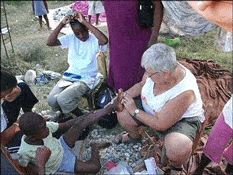 This photo, courtesy of The Lazarus Project, appeared originally with the Post's article. In it, Debbie Berquist of the Lazarus Project treats a student in Haiti. 