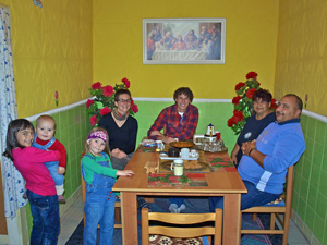 Visiting with YAGM Thad and his host family. Photo from "Spread the Good News" blog.