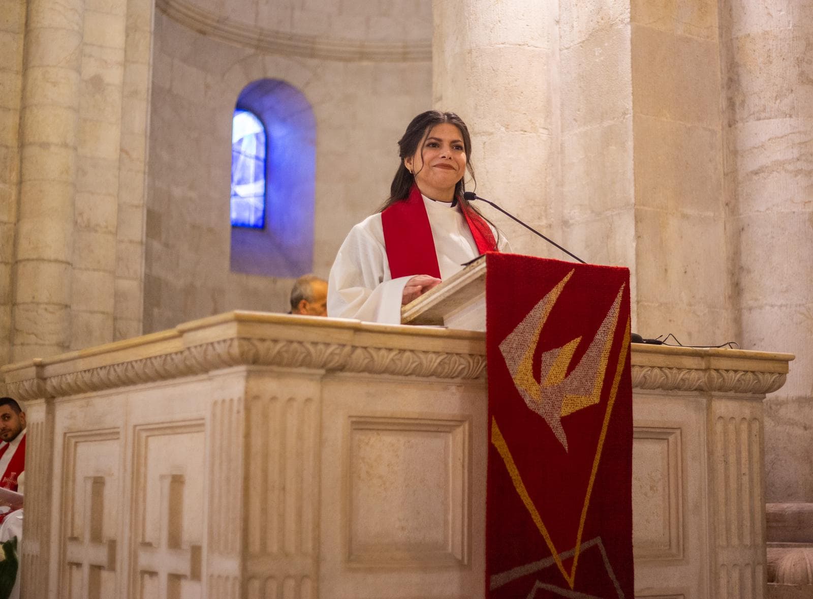 Rev. Sally Azar at the pulpit